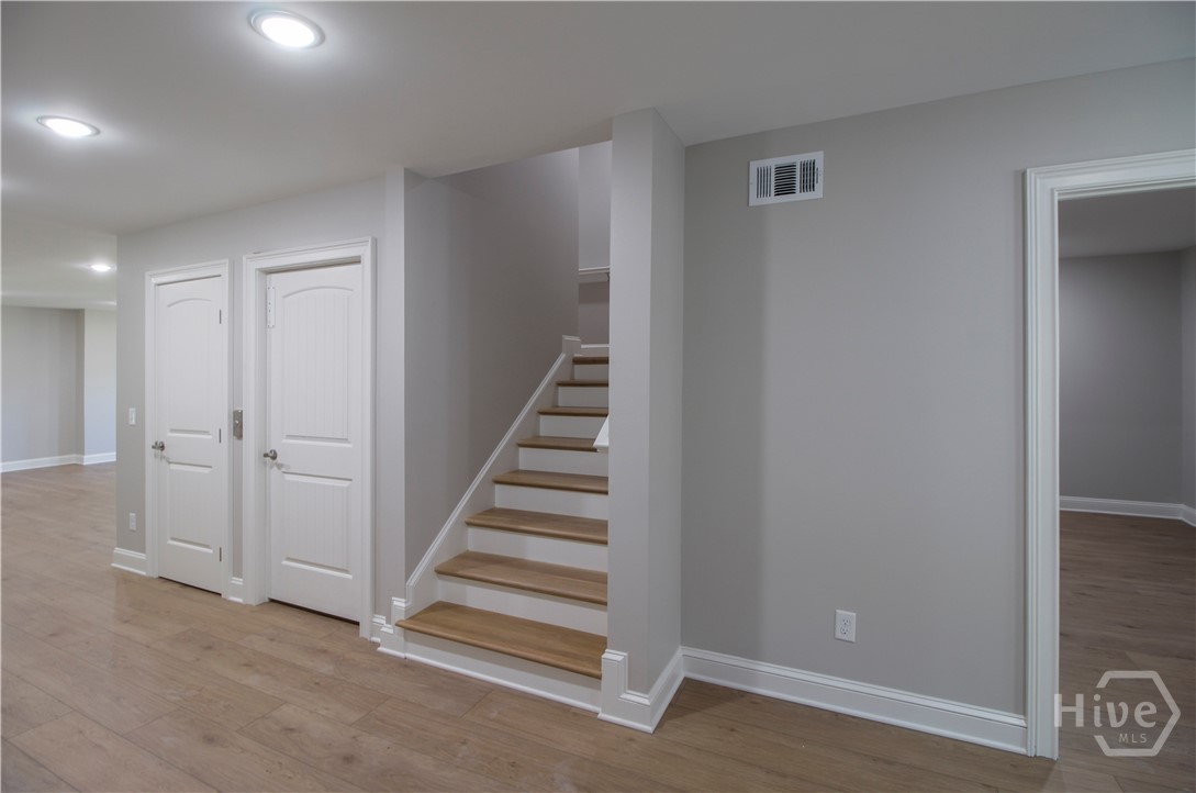 Ground level with stairs and elevator to left to upper floors