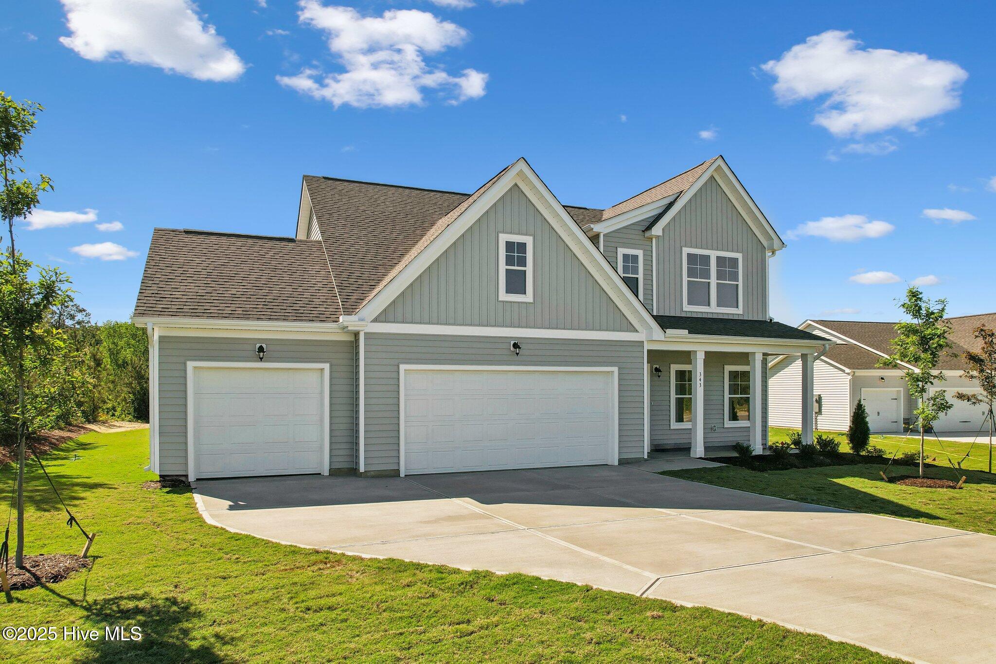 Angled Farmhouse - 3 Car Garage