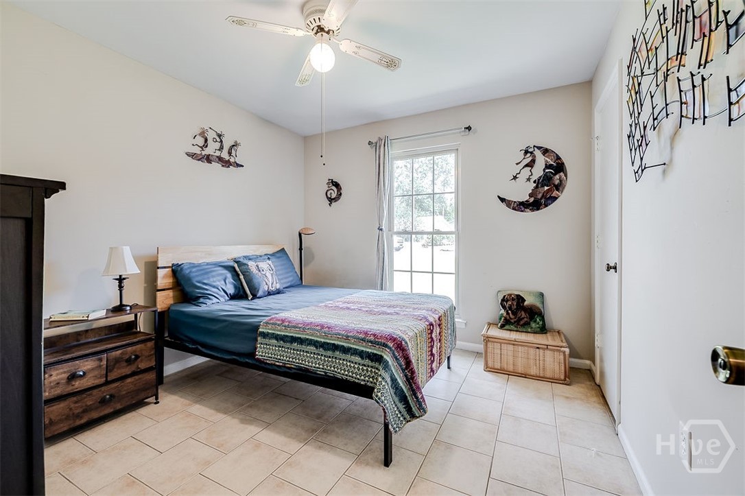 Third bedroom with tile flooring
