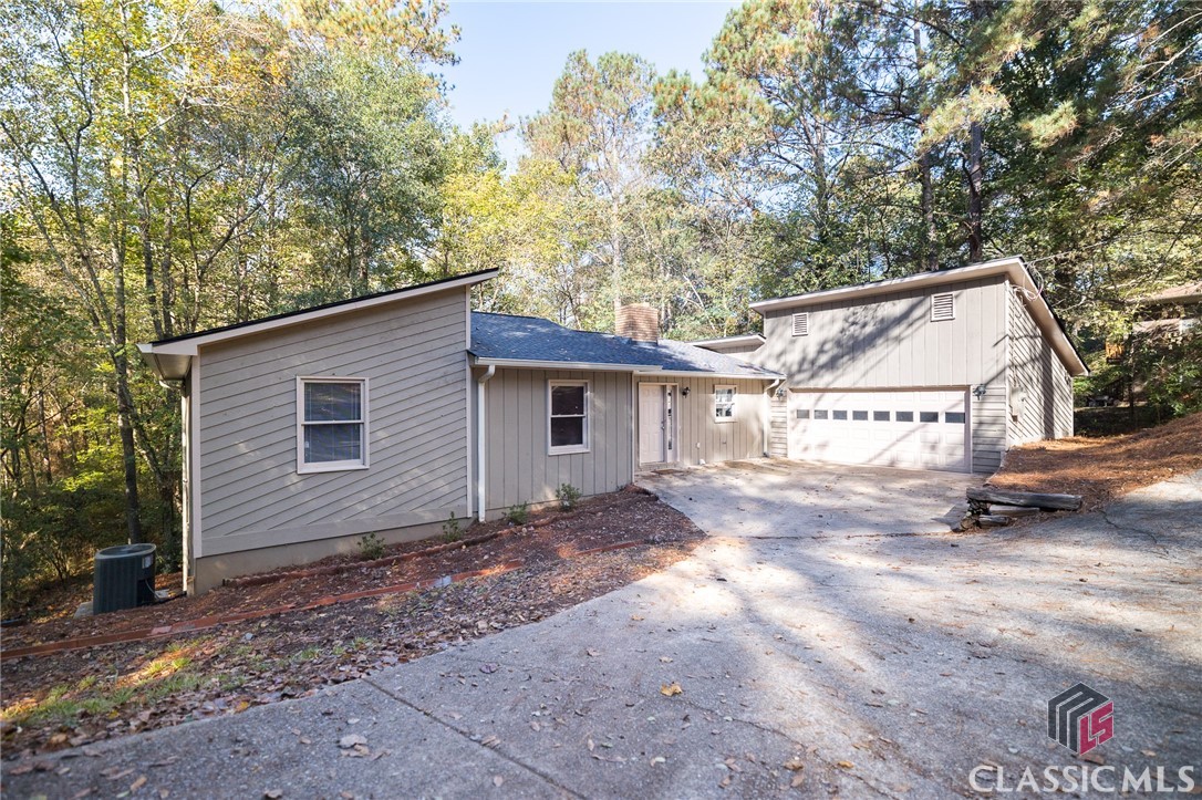 Nestled between the UGA Vet School and Five Points, this updated property is the perfect investment which could yield amazing returns! The house is just over 3000 SF and offers 4 bedrooms and 3 full baths. There is also a large "rec room" on the terrace level with its own door that most individuals would use as a large 5th bedroom, or otherwise as an amazing game room or home gym!The main level features an updated galley kitchen, spacious den with a wood burning fire-place and access to the back deck, dining area and 3 bedrooms and 2 full baths. The terrace level is home to the 4th bedroom, new full bath and huge rec room.The half acre lot backs up to the Oconee River where there are walking trails with easy access from the rear yard, which is also fenced in. There is also a 2 car garage along with a semi circle drive that allows for ample parking.The current owners have made significant updates including:New Roof,New HVAC,New Floating Floors Throughout,New Granite Countertops in Kitchen,New Appliances,New Deck,Added a Full Bath to the Terrace Level,Replaced the other Tub/Shower inserts in the Main Level Baths;Built out the Terrace Level with a Bedroom, Rec Room, Flex Space and Full Bath.Also added a New Garage Door,New Gutters,And other Maintenance Updates include some electrical and plumbing.The Terrace level has two exterior doors, and one interior access door.  Therefore, if a buyer so desired, they could easily create an in-law suite or separate apartment. The lay out is ideal for this with a perfect spot to add a kitchenette.