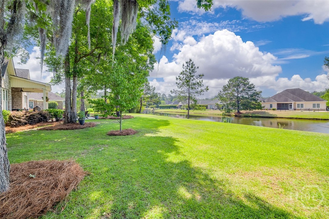 Large backyard, beautiful lagoon view, known for pleasant breezes frequently, with an invisible fence for dog lovers