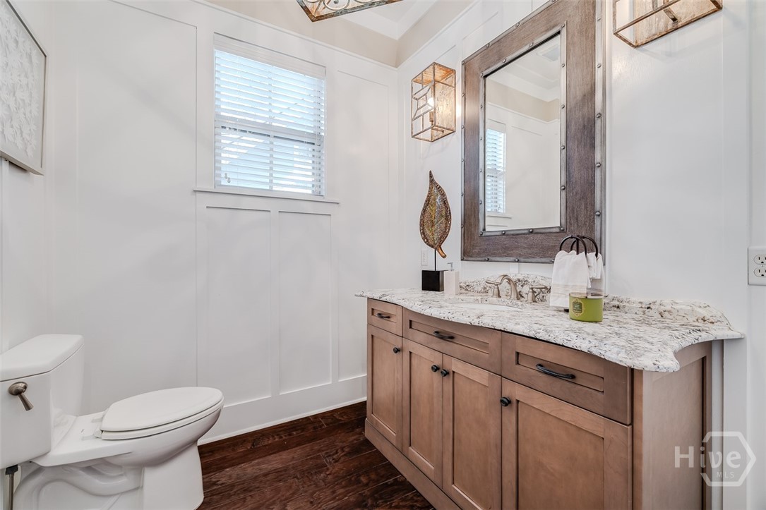 Half bath off of the kitchen and den area