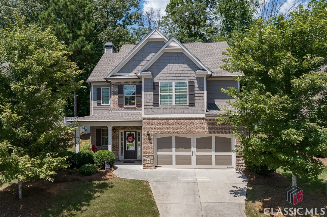 Welcome to 236 Towns Walk, conveniently located in the highly desirable Towns Walk neighborhood, just off the bustling Timothy corridor. The entrance of the house has a welcoming front porch perfect for enjoying a beverage and socializing with neighbors. The main floor features an open floor concept, hardwood floors, and an abundance of windows that provide ample natural light. The foyer leads the way into the generously sized den with its stone fireplace and hearth, which flows into the kitchen and breakfast room.  The kitchen features granite counter tops, stainless appliances, tile backsplash, and an island perfect for entertaining or family gatherings.. Upstairs you will find a spacious owners suite with tray ceilings, a large walk in closet, and a renovated bathroom complete with a double vanity, soaking tub, and tile shower.  The other three bedrooms are also upstairs and share a hallway bathroom.  Two of the bedrooms have vaulted ceilings. The backyard is private and has a concrete patio. Included in the HOA are common area maintenance, sidewalks, waste pick up, neighborhood pool, and lawn maintenance.  This house has been impeccably cared for and is in perfect shape for someone to move right in without having to change a thing! Towns Walk is conveniently located near shopping, dining, Loop 10, and schools, and it is a short drive to UGA or downtown. Owner wants to maintain occupancy until October 16, 2023.