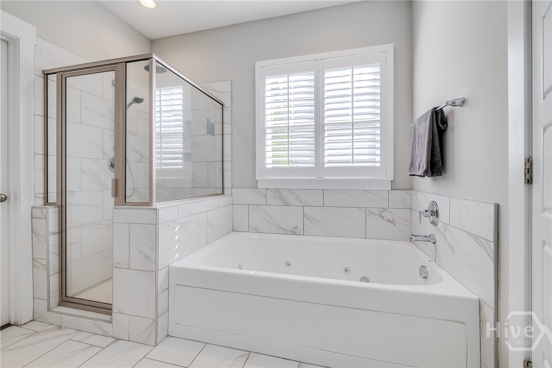 Primary Bedroom - Tiled shower and Garden Tub
