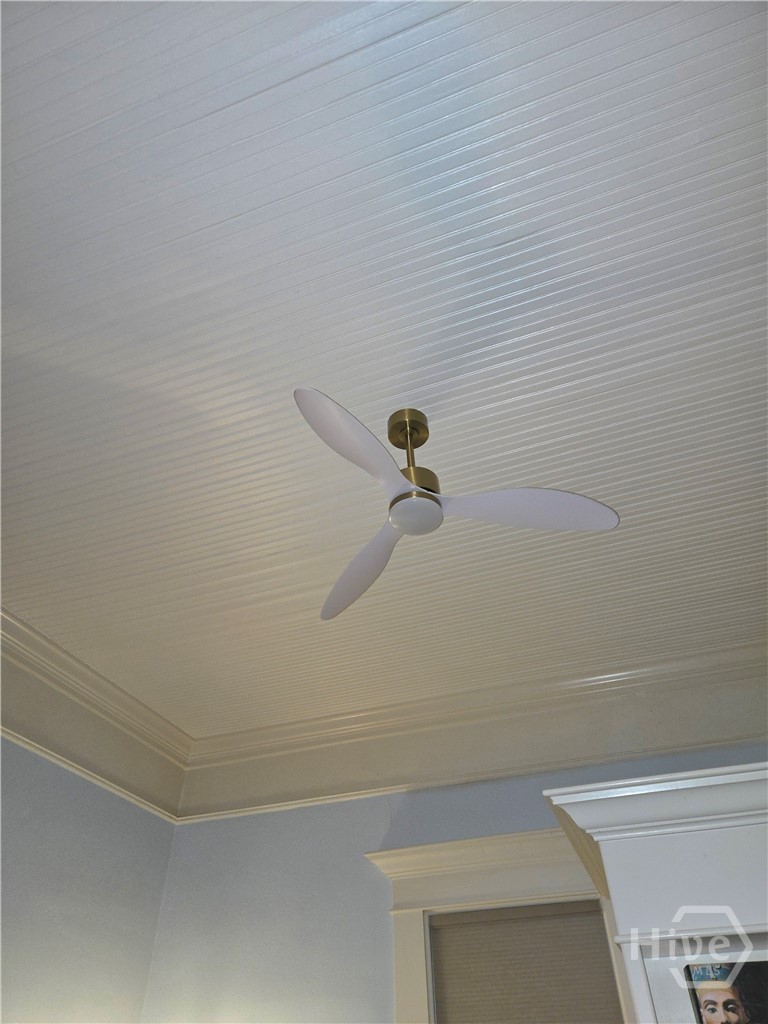 Beadboard ceilings with ceiling fans and tasteful