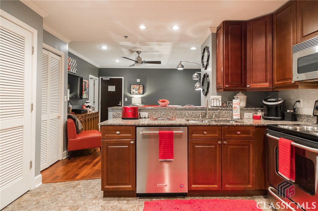 Penthouse Suite 809 is the largest 2 Bed, 2 Bath floorplan in Georgia's  GAMEDAY Center with a view towards the UGA Arch and Sanford Stadium. Excellent Condition. Upgrades include; hardwood flooring in living area, newer carpet in bedrooms, hazelnut cabinetry with stainless steel appliances (including brand new kitchen aid dishwasher), granite countertops, newer tile in kitchen and bathrooms, crown molding throughout, built-in bar area and walk-in closet in primary bedroom. Two numbered, covered, reserved on-site parking spaces.  All GAMEDAY condos are fully furnished with all furniture, appliances, electronics, and household items included in the price. Georgia's GAMEDAY center is the only property in Athens, GA with 24/7 Front Desk staff acting as concierge, on site housekeeping and on site handyman. Security cameras throughout the building and 5 level on-site parking deck. GAMEDAY is also the only hotel-condominium in Athens. OPTIONAL on-site management company will lease the condo for you when are not there. The on-site management company lesses nightly, weekly, monthly, and long term. Walk to Sanford Stadium and UGA campus. Association dues cover water, sewer, trash pick up, common area maintenance, insurance on building, hi-speed internet access, extended satellite television, security, and parking. Seller is accepting offers through Sunday April 2, 2023 at 6pm.