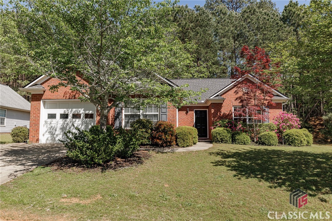 Welcome to 199 Pine Ridge Trace! This well maintained, turn-key home is situated in the established Pinecrest neighborhood with easy, one level living. Inside you’ll find the split bedroom layout provides privacy where you want it, with a primary suite on one side of the home and two secondary bedrooms on the other. The primary bedroom features an en-suite bath with dual vanities, a step-in shower, separate soaking tub, and roomy walk-in closet. Offering both comfort and connection, the living room is centered around a cozy wood burning fireplace giving you space to relax, catch up, or binge your favorite shows. The kitchen is nicely sized, with plenty of cabinet and counter space, and an open flow to the dining area that makes it easy to cook while staying part of the conversation. Bordered by trees and greenery, the private backyard patio invites you to slow down and unwind. 199 Pine Ridge Trace is perfectly positioned just minutes from the new Eastside Kroger Marketplace, UGA Veterinary Teaching Hospital and the YWCO, as well as popular East Athens coffee shops and dining spots. With its excellent flow and great location, this home is a must-see for anyone seeking a comfortable, low maintenance lifestyle. Don’t miss your chance to call this delightful home your own - Schedule a tour today.