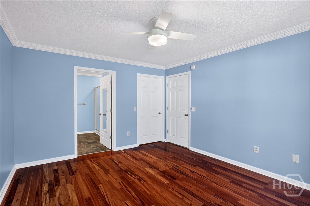 In the master bedroom with your back to the window - looking at the entrance to the  master bath, walk-in closet door and entry door to the room