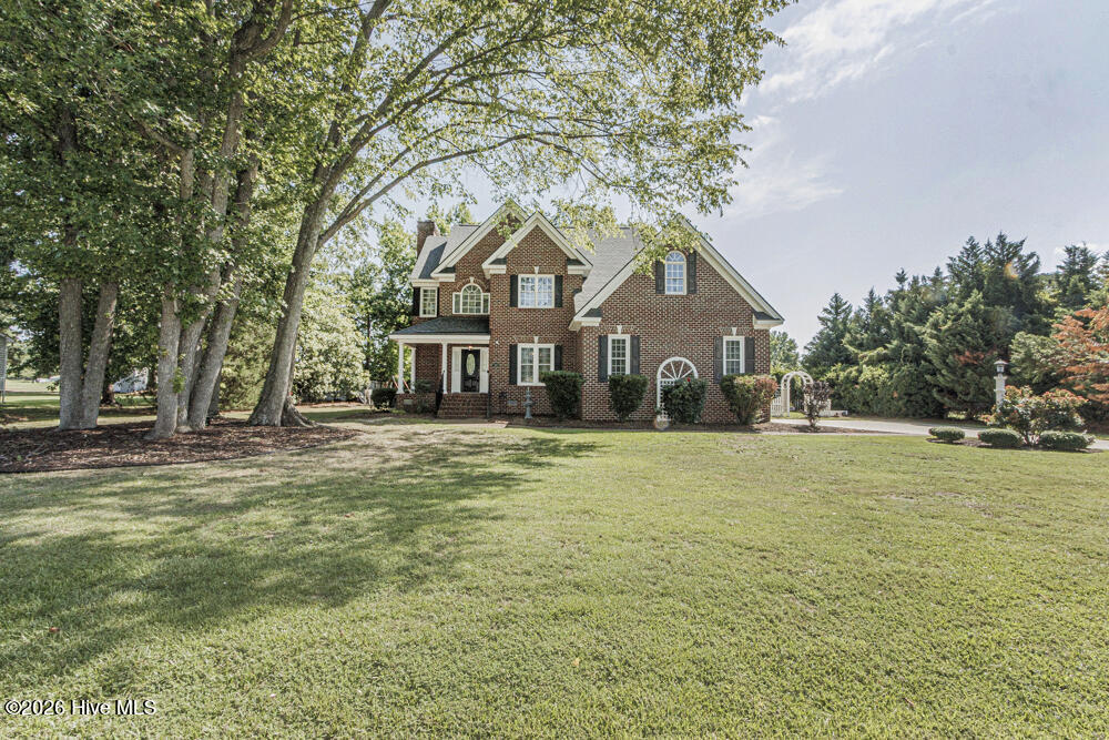 Custom built with double attached garage, spacious rooms, open flow and lush landscape!