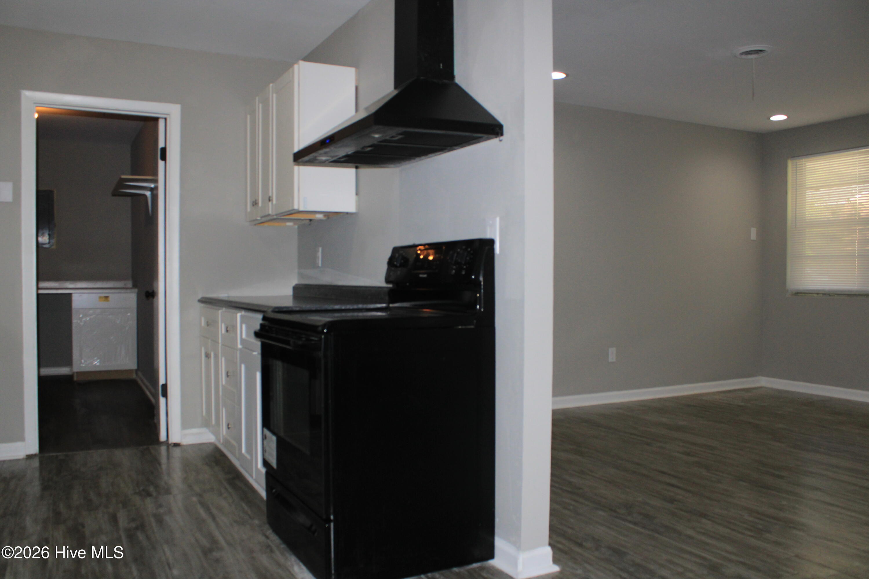 Laundry Room Entry. Features Folding Counter W/Cabinet