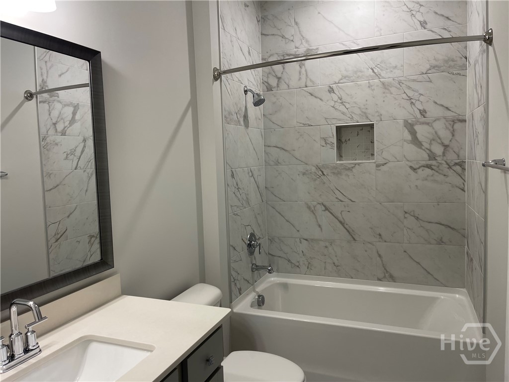 Secondary Bath with Tile Walls
