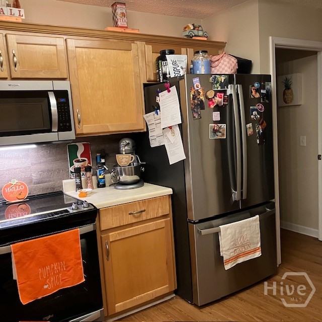 Kitchen with refrigerator