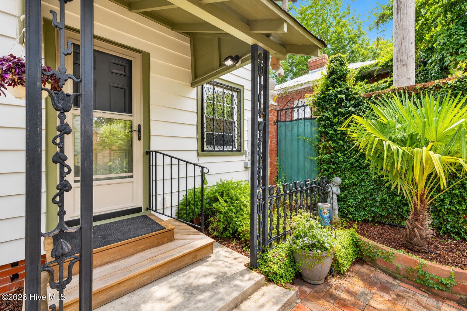 back porch leads out to private walled courtyad