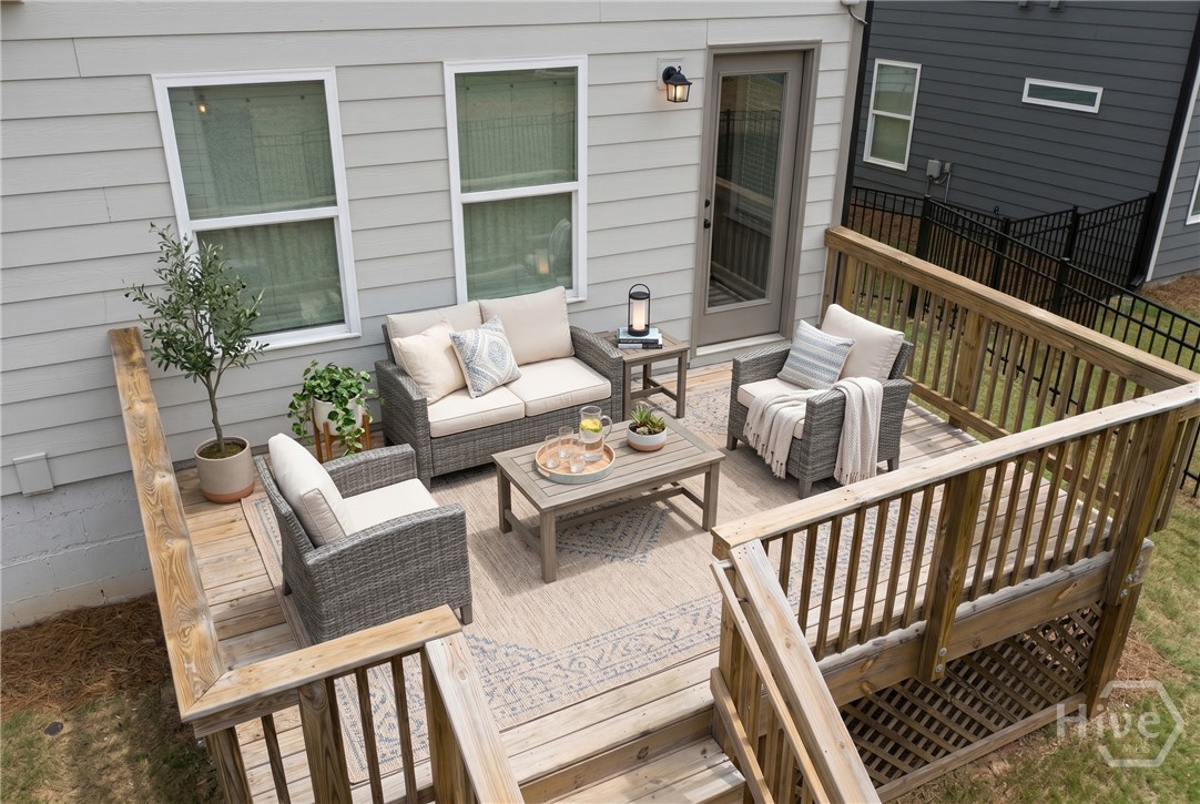 Back Deck: Seamlessly connected to the living room, this oversized back deck is an entertainer's dream with steps leading directly down to the lawn.
