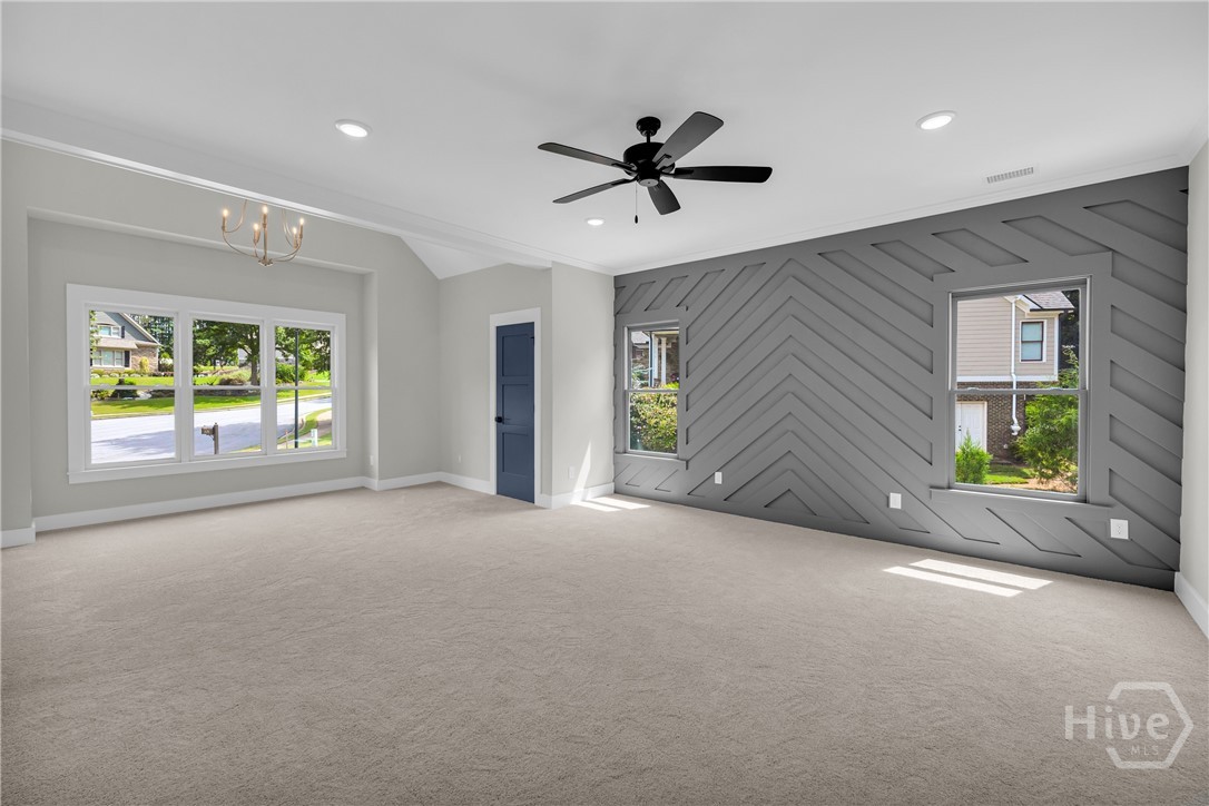 The spectacular owner’s retreat is a destination of its own, complete with a designer accent wall, private sitting area, pocket doors leading to a spa-inspired bath, and a unique secret passageway that adds a touch of charm and character you won’t find elsewhere.