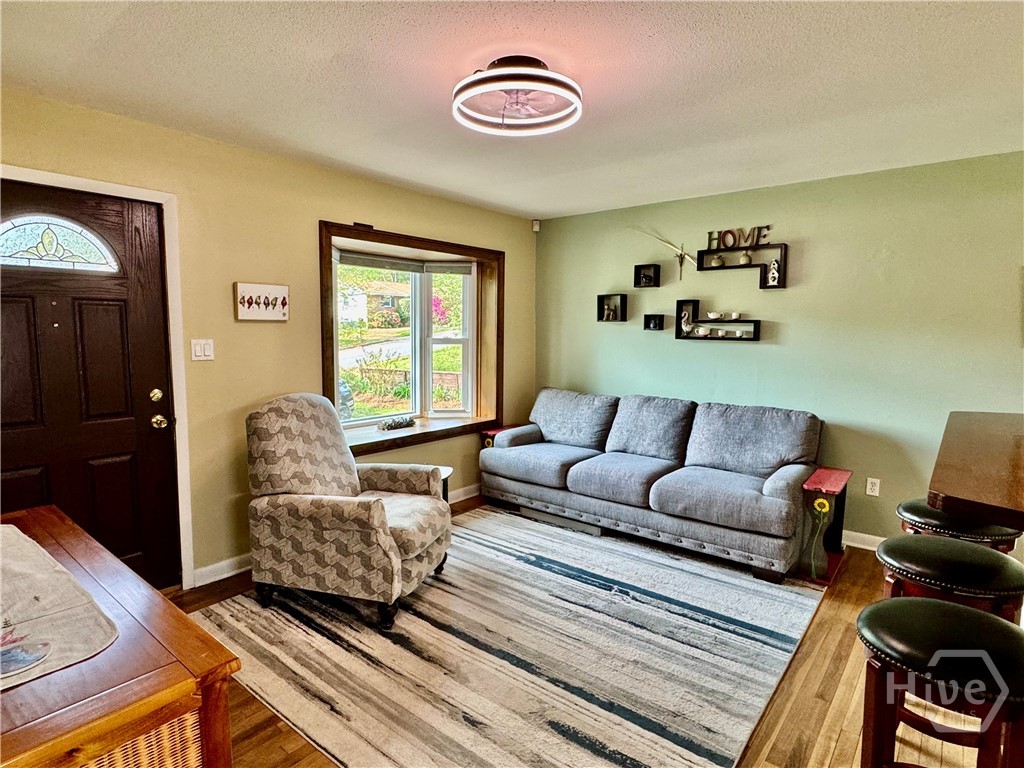 Living room blinds open in Bay window