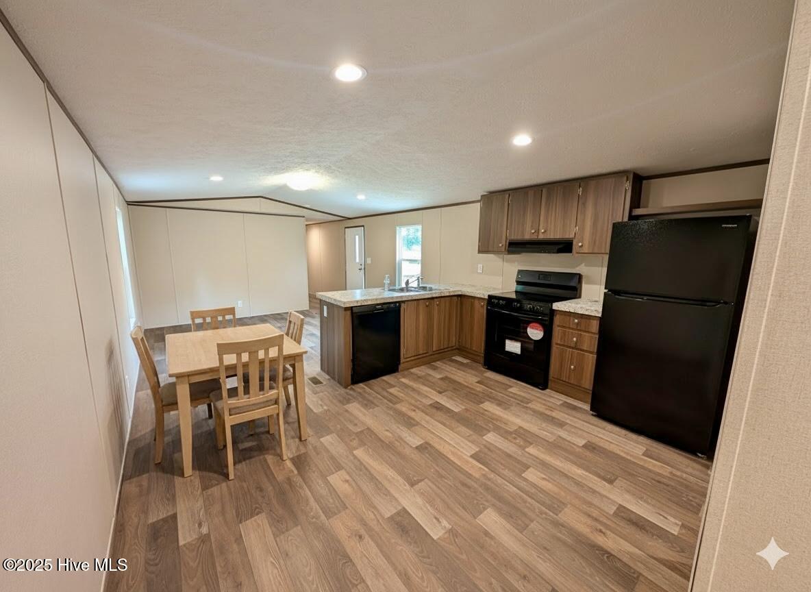 612 Bayshore Drive SE, Bolivia, NC 28422 – photo 6: Kitchen with AI added furniture