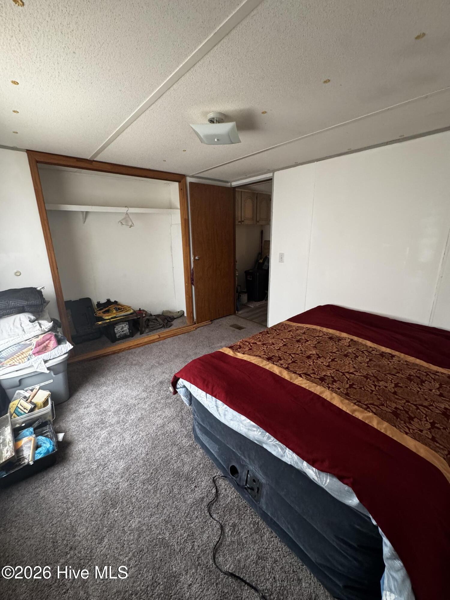 3rd bedroom with new carpet and large closet