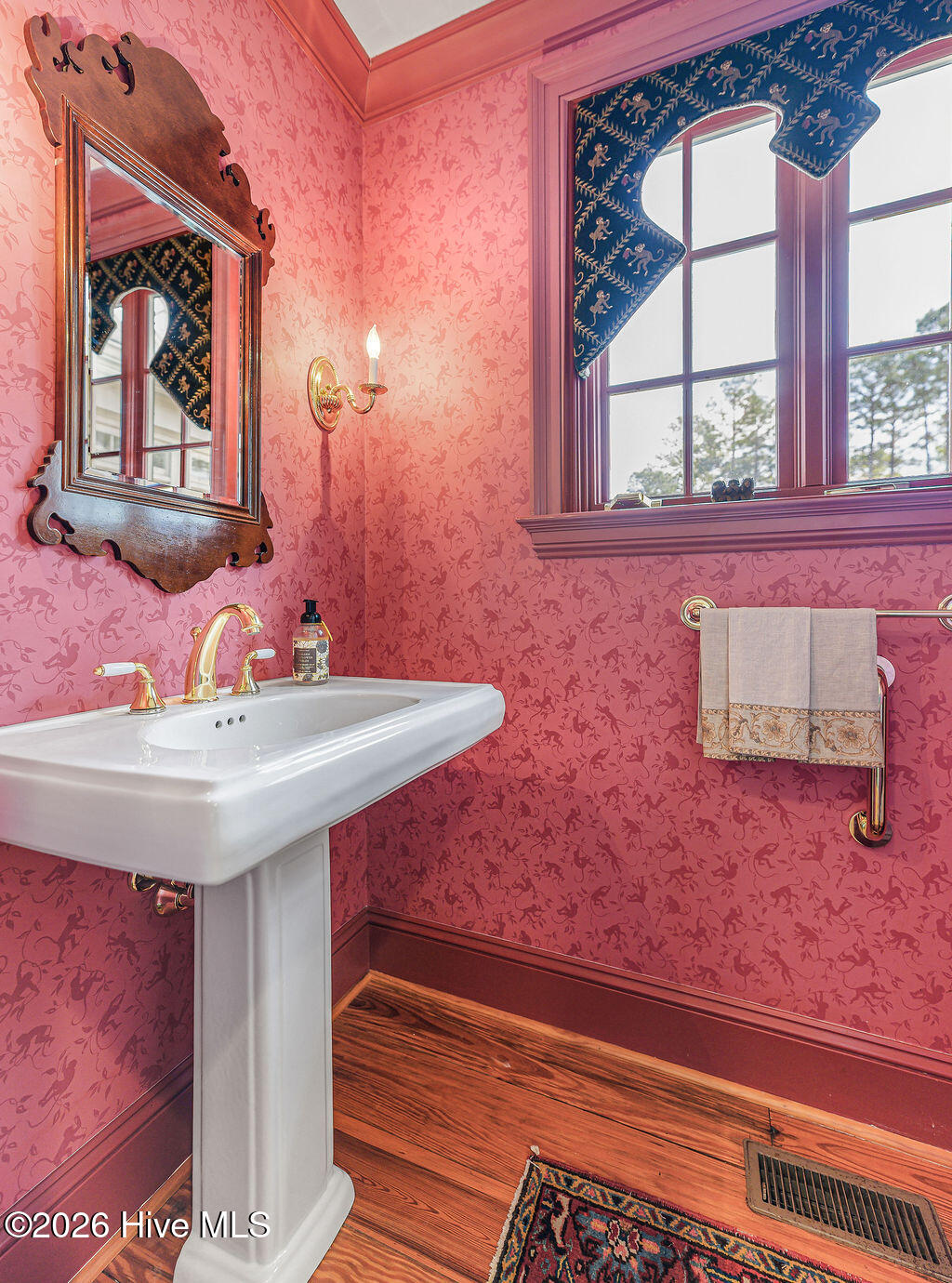 Fuchsia chinoiserie wallpaper powder room off kitchen
