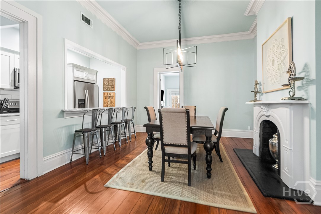 Dining room with chandelier lighting.
