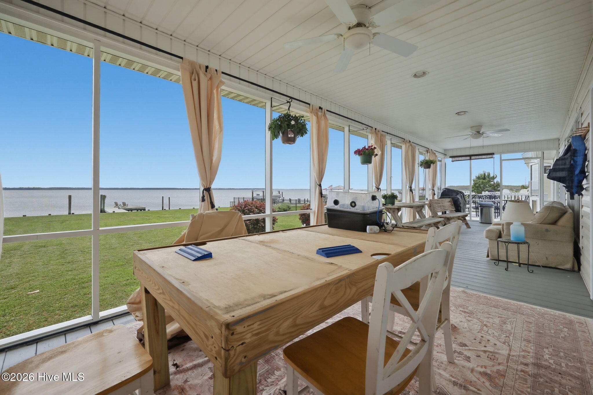 Shady screened porch with a cool river breeze.