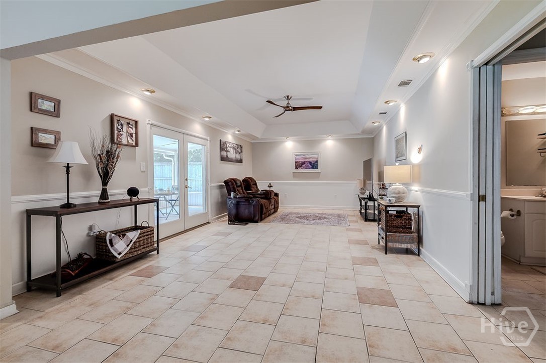 The living room portion of the Great room has a dramatic, deep tray ceiling with adjustable reset lighting. Plenty of room her for your furniture.