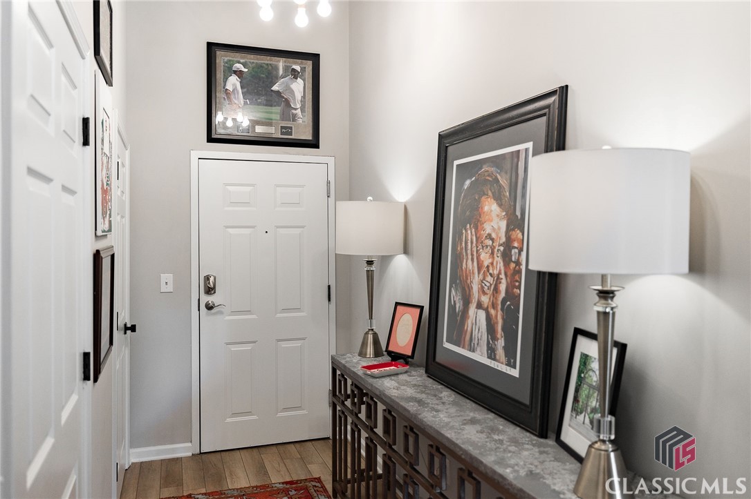 The Cotton Exchange Suite 207 - spacious 2 bed 1 bath. Completely renovated, fully furnished chic Downtown Athens, GA home away from home. New kitchen & baths, appliances, electronics, plumbing & electrical fixtures, flooring, furnishings, and housewares. Everything is included in the sale except artwork and personal items. Exclusive loft living in the heart of Downtown Athens. Cotton Exchange Lofts are nestled above the rich culture and nightlife of Hull and Washington Streets. High ceilings and exposed brick radiate the true textures of Southern living, while modern amenities and urban views provide an exclusive lifestyle in one of the nation's top University towns. Walk to UGA and Sanford Stadium! This hip 2 bedroom has a unique layout with historical charm. 1 private parking space in on-site covered garage, controlled entry access, foyer, laundry, kitchen with dining area, and a living room with soaring ceilings. Sample a local beer downstairs. Shop the unique boutiques just outside the front door. Enjoy nationally renowned cafes, restaurants and music venues just a few steps away. Immerse yourself in everything Downtown Athens, GA has to offer.