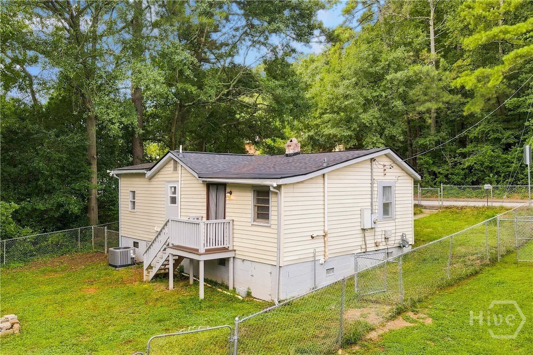 Side View of Home and Fenced Yard