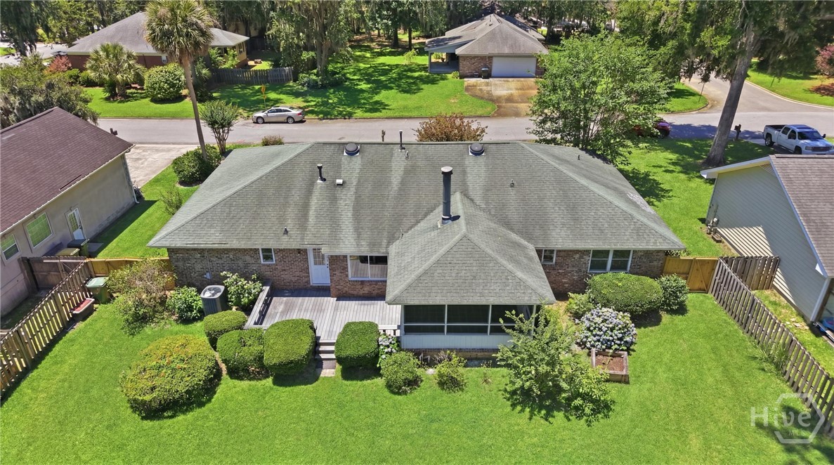 114 Sea Palm Rd fenced backyard with Trex deck and screened porch
