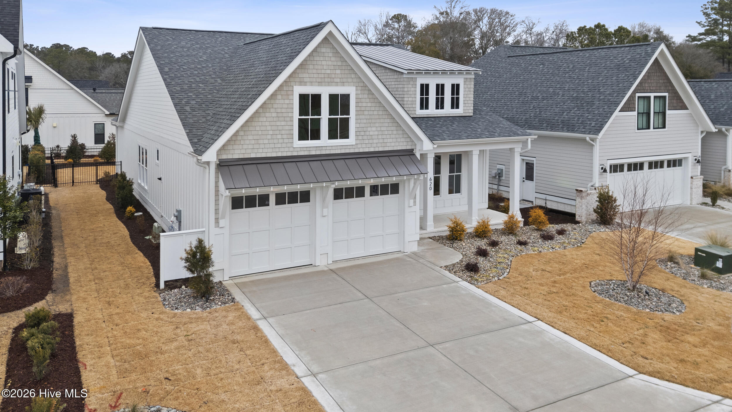 Side view of home, 2 car garage, street parking