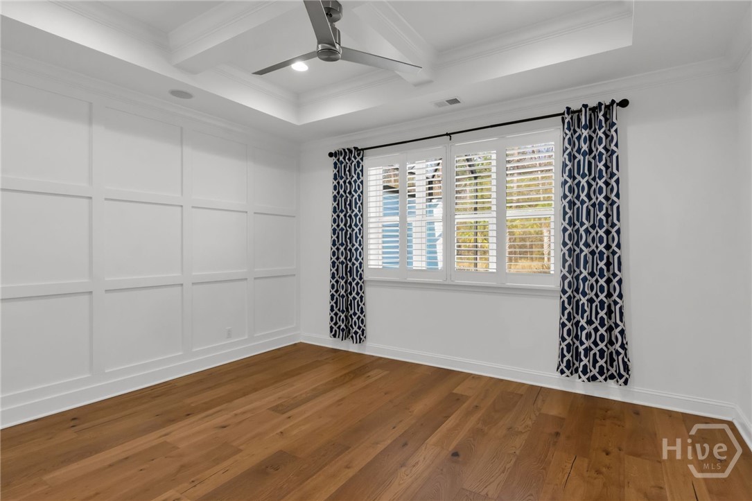 Coiffed ceiling, detailed accent wall, plantation shutters, dual closets, music speakers in ceiling