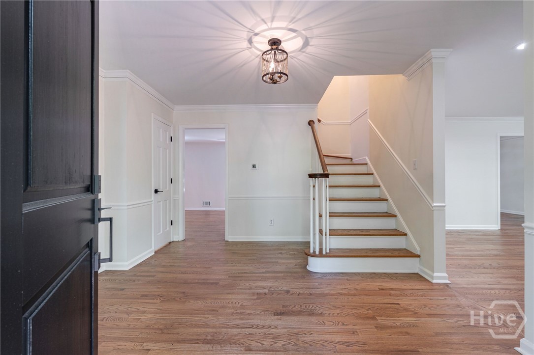 Foyer: An elegant entrance showcasing gleaming, re