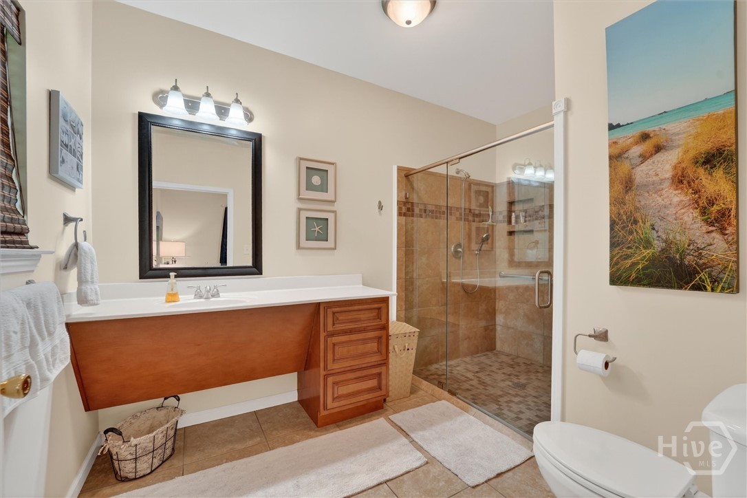 Guest en-suite bath #1. Wheelchair accessible, with walk-in shower