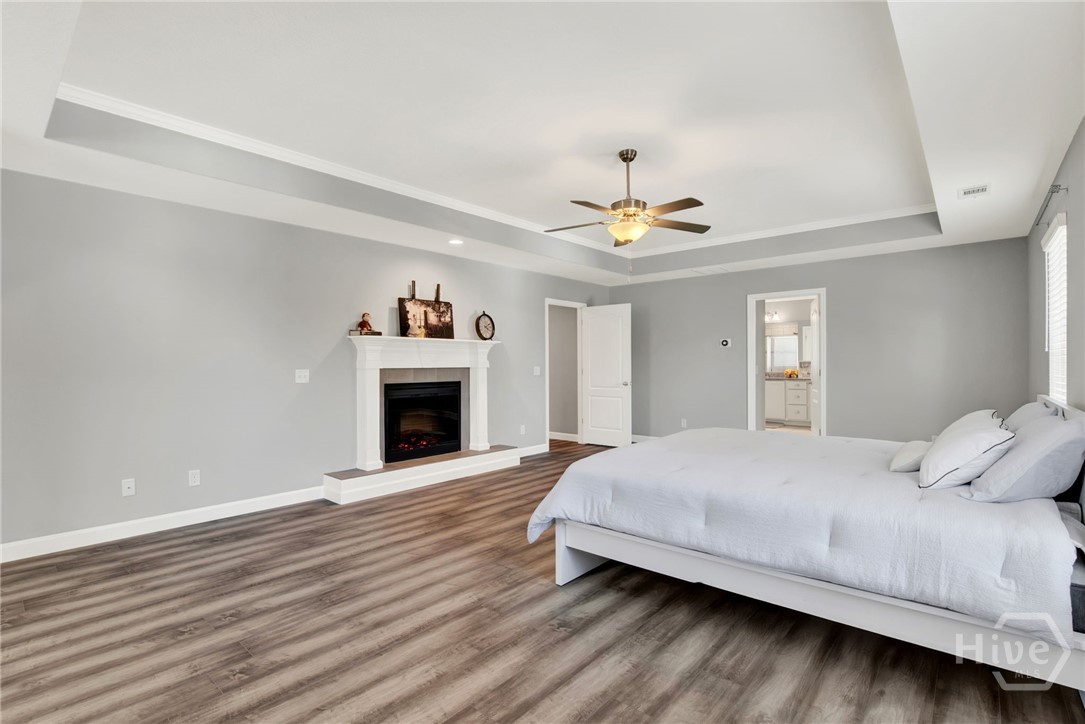 Expansive Primary Suite with Sitting Area and Fireplace