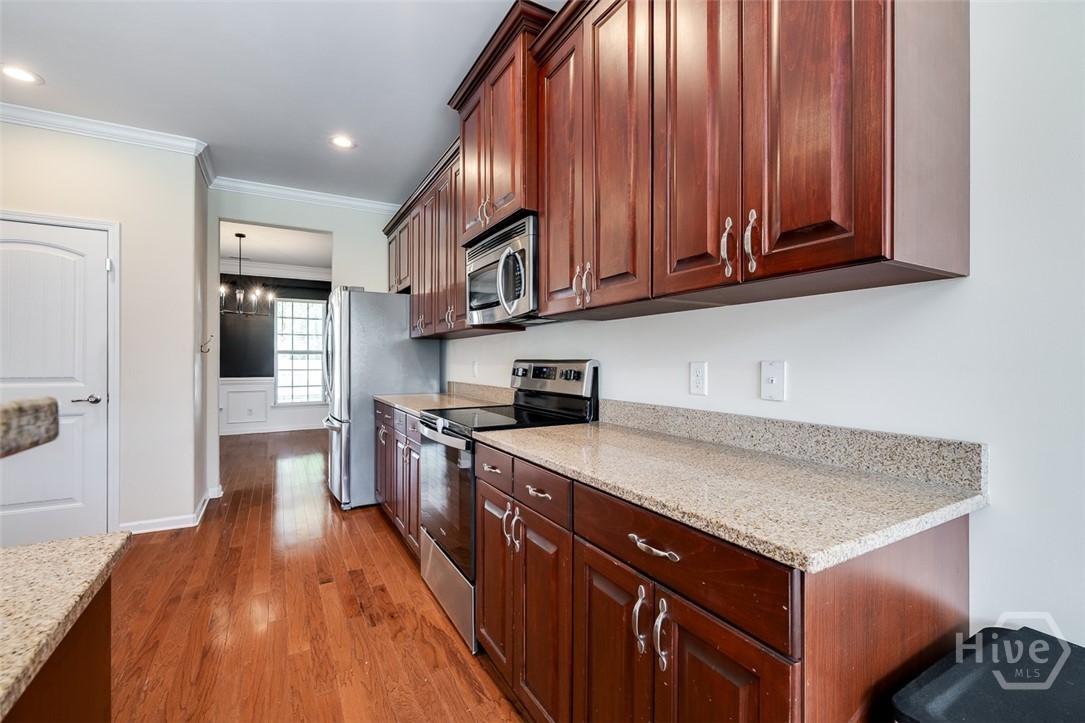 Dining opens to the kitchen. Perfect flow and great for entertaining!