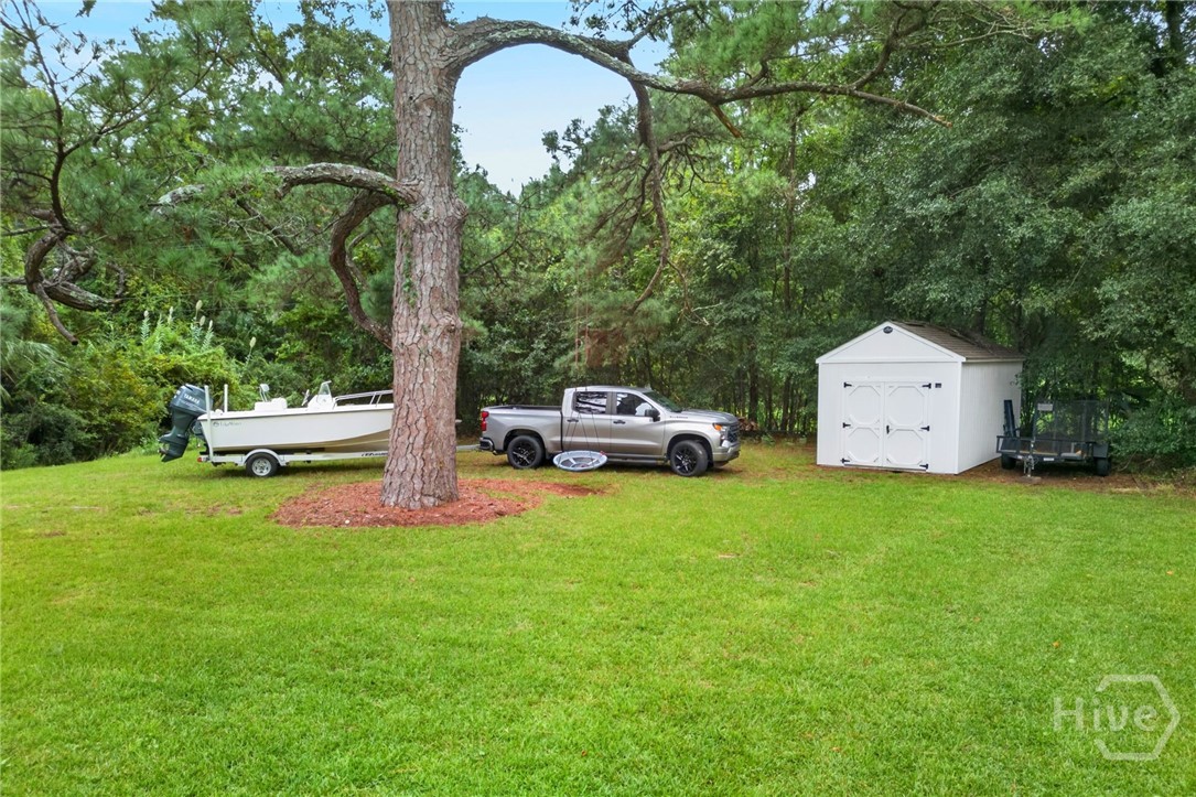 Car and Boat are not for sale.  But the yard allows for keeping your boat in the back yard.