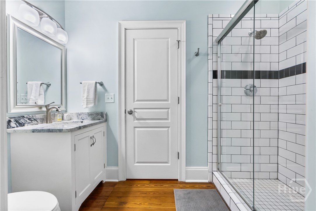 Ensuite bath with bedroom and hallway entries.