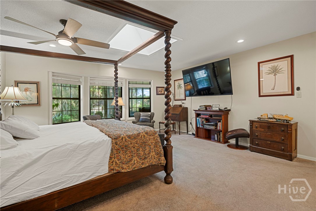 Primary bedroom overlooking the water