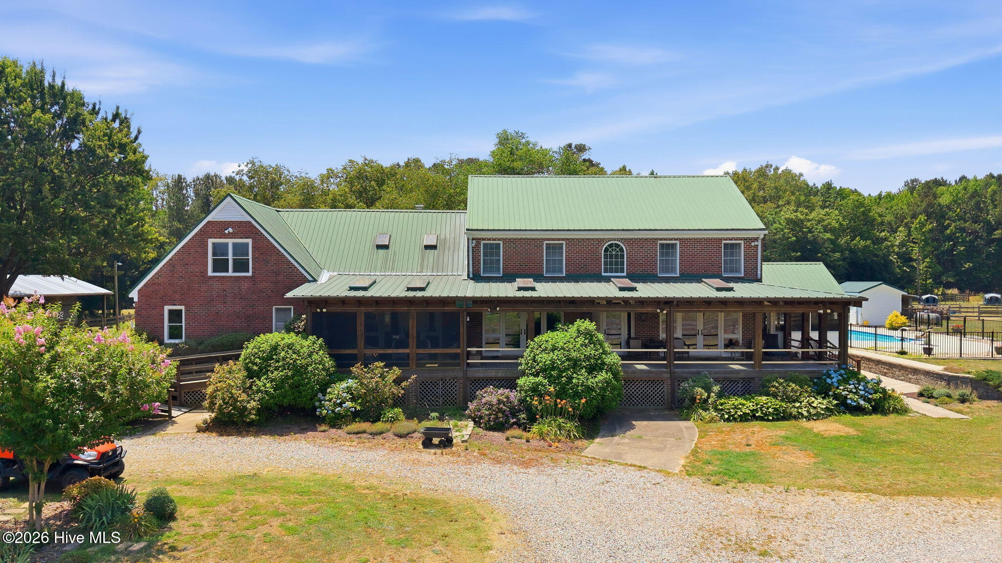 Paradise Found! Gated for privacy and security this100 acre property features pastures, TWO stocked PONDS, woods, hayfields, RIDING TRAILS, shelters, 40x100 BARN, workshop w/storage All this, and a warm and welcoming spacious residence- open concept, two primary suites Bonus space and multiple porches -screened and covered.The in ground pool was added in 2021 and features generous patio surround, shelter for shade and fully fenced. All this in a convenient location in Nash County with easy access to amenities and I 95, and hwy 64 Schedule your tour today!