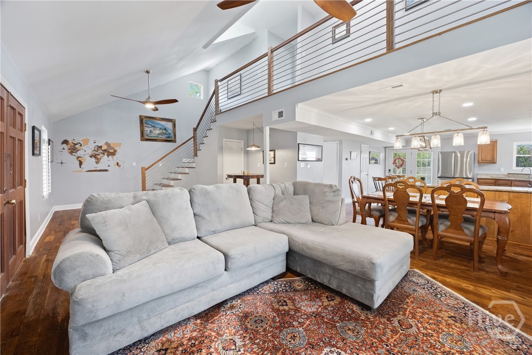 Open concept layout with staircase and loft overlo