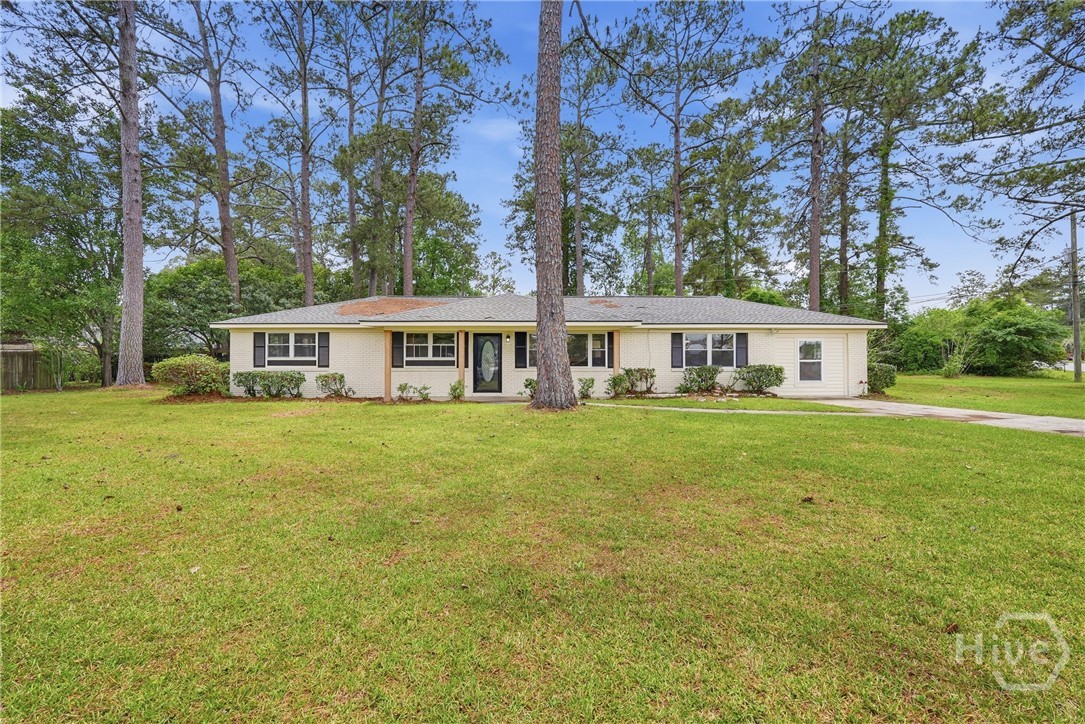 Turn-key and tastefully renovated, 200 Frontage Rd. delivers the rare combination of modern updates and a sprawling .77-acre lot in the heart of Rincon. This 3-bedroom, 2-bath retreat was thoughtfully remodeled in 2025 with brand-new flooring throughout, fresh interior and exterior paint, and a showstopping primary bath wrapped in designer tile and finished with a sleek new vanity. The open-flow living, dining, and kitchen spaces are made for effortless gatherings and easy day-to-day living. Step outside to a generous yard with room to roam — plant a garden, add a pool, park the RV or boat, build a workshop, or simply enjoy the space and privacy that newer subdivisions just can't match. A covered carport plus a detached garage provide standout storage, parking, and hobby potential. Tucked in Effingham County and minutes from Hwy 21 and I-95, you're a quick drive to Pooler, Gulfstream, Hunter Army Airfield, JCB, and the dining and historic charm of downtown Savannah. Newer-build feel without the new-build price tag — schedule your private tour before this one is gone.
