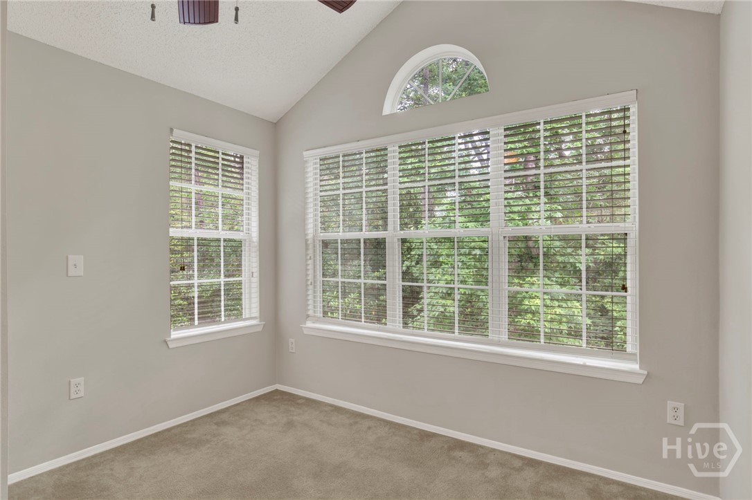 Sun room with cathedral ceilings with private view