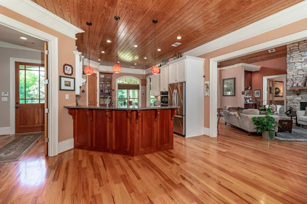 Kitchen w/ ornamental pendant lights