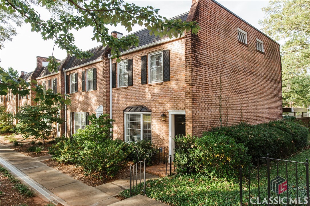 Welcome to 30 N. Stratford Dr., a move-in ready 2 bedroom, 2.5 bath condominium. Located in the stable and sought-after Stratford Condominiums, this end-unit property boasts a host of features that make it an ideal urban retreat. Enjoy amenities such as swim, tennis, a clubhouse, and close access to public transportation. On the main level, you'll find a clean and modern interior that creates an inviting atmosphere, with abundant natural light from the large bay window. The kitchen has undergone a total renovation, showcasing new cabinetry, countertops, double pantries and LVP flooring. The main level also includes the half bath and laundry closet. On the second level, you'll discover two spacious bedrooms, each with its own private en suite bath and ample closet space. Outside, a private patio provides a perfect spot for morning coffee or evening relaxation, while the picturesque landscaping surrounding the condo creates a serene and private atmosphere. This condominium offers not only an updated interior but also the charm of a classic brick exterior. Located super close to the University of Georgia and the Vet School, as well as Eastside shopping destinations like Aldi and Publix, this property makes commuting and errands a breeze. Whether you're a student, a busy professional, or a downsizer, 30 N. Stratford Dr. is the perfect choice for those seeking comfort and convenience. Don't miss the opportunity to make this wonderful condo your own. Schedule a private viewing today and experience the ease and appeal of Stratford Condominium living for yourself!