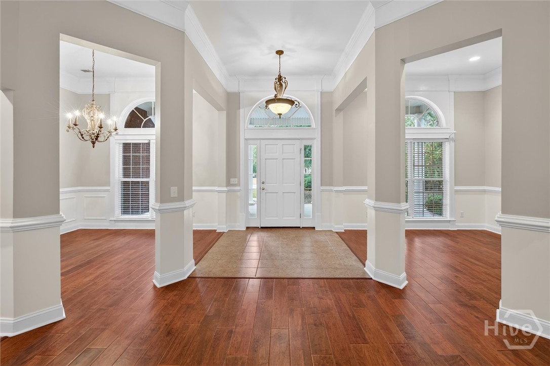 Stunning entrance with view of dining room and flex space/sitting room