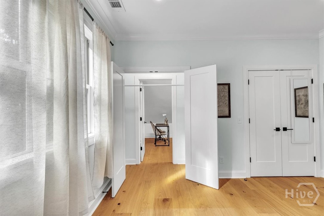 Hidden space behind one of TWO closets in this bedroom.