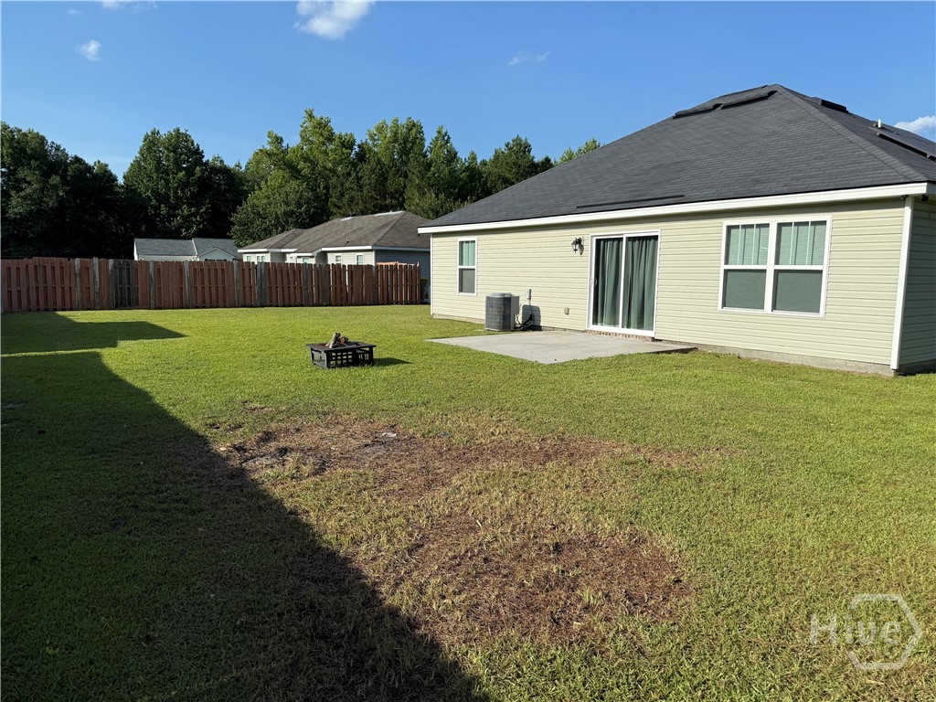 Large Back yard with grilling patio.