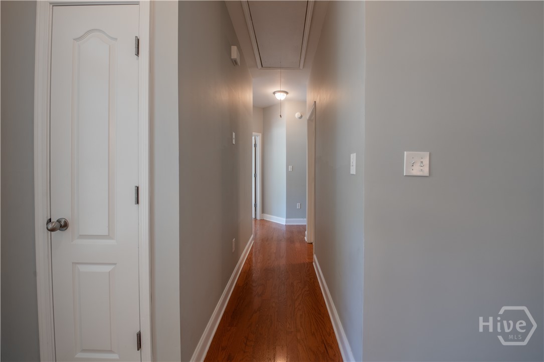 Hallway to Primary Suite Side of Home