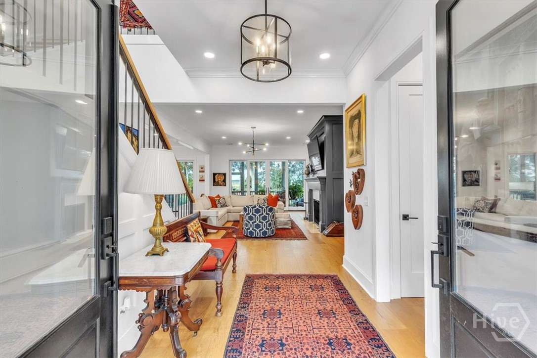 Double door entry with large foyer and open floor plan.