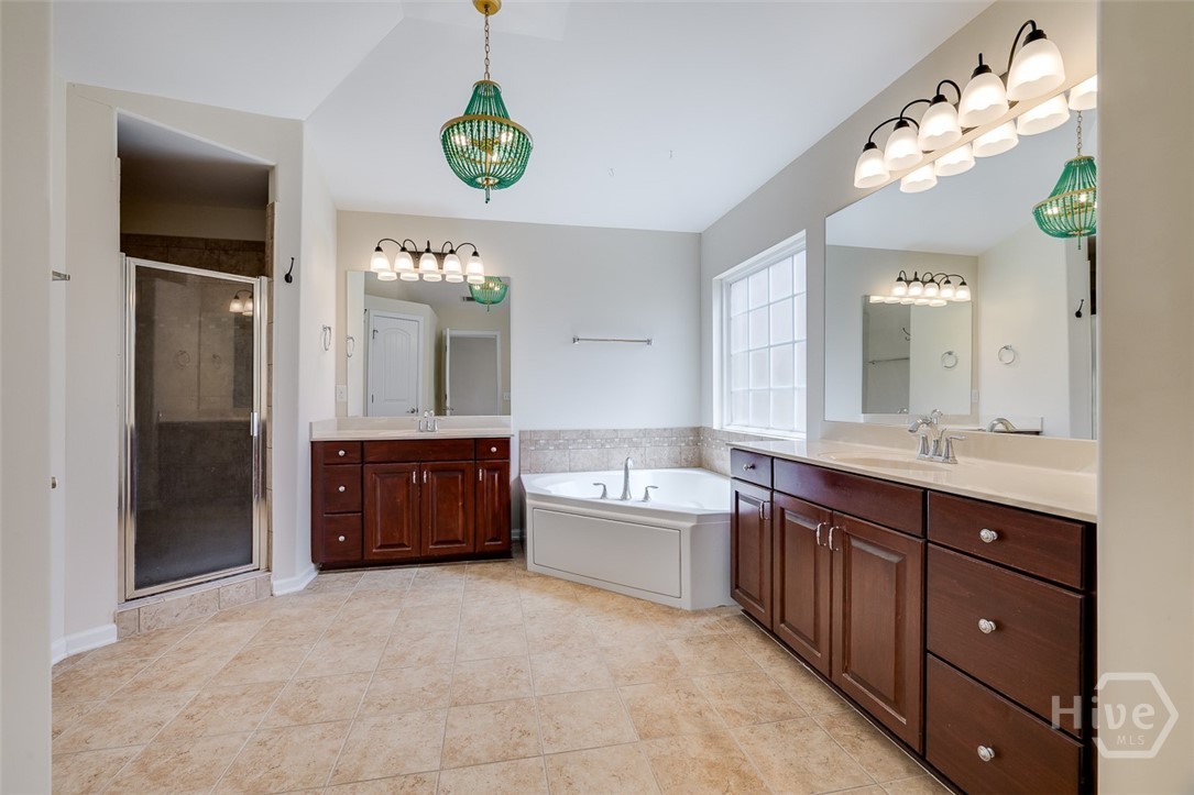 Primary bath with dual vanities, separate tub and shower